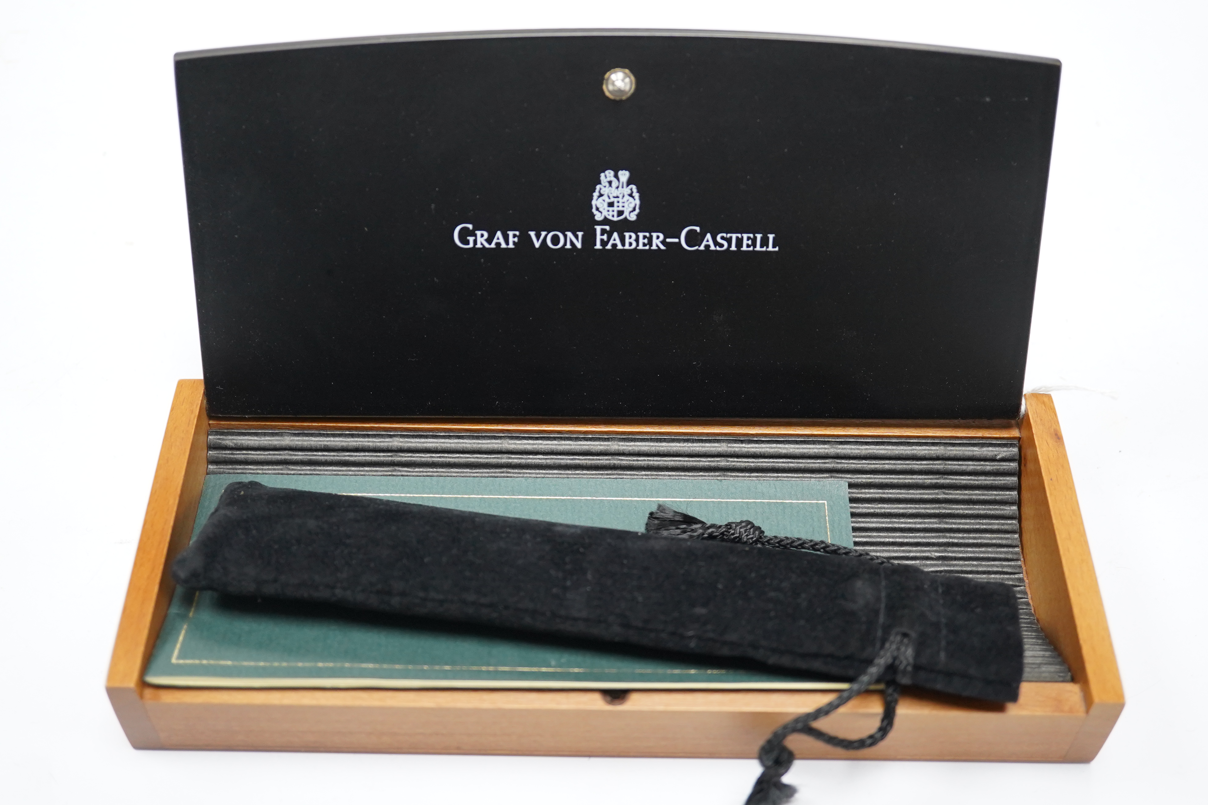 A cased Graf von Faber - Castell fountain pen with wooden handle, 13cm long. Condition - good